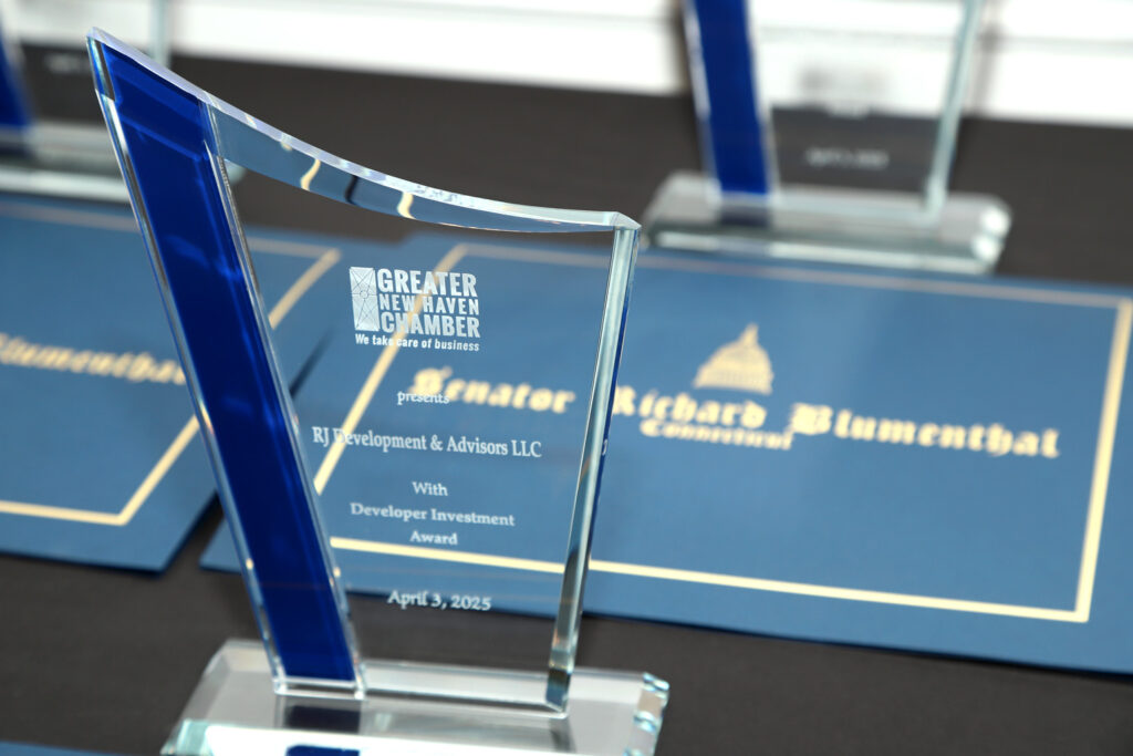 Developer of the Year award sitting on table in front letters from Senator Richard Blumenthal